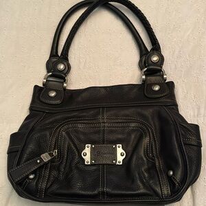 B. Makowski black leather bag 13 x 11 x 3” with 9” shoulder drop
Genuine leather